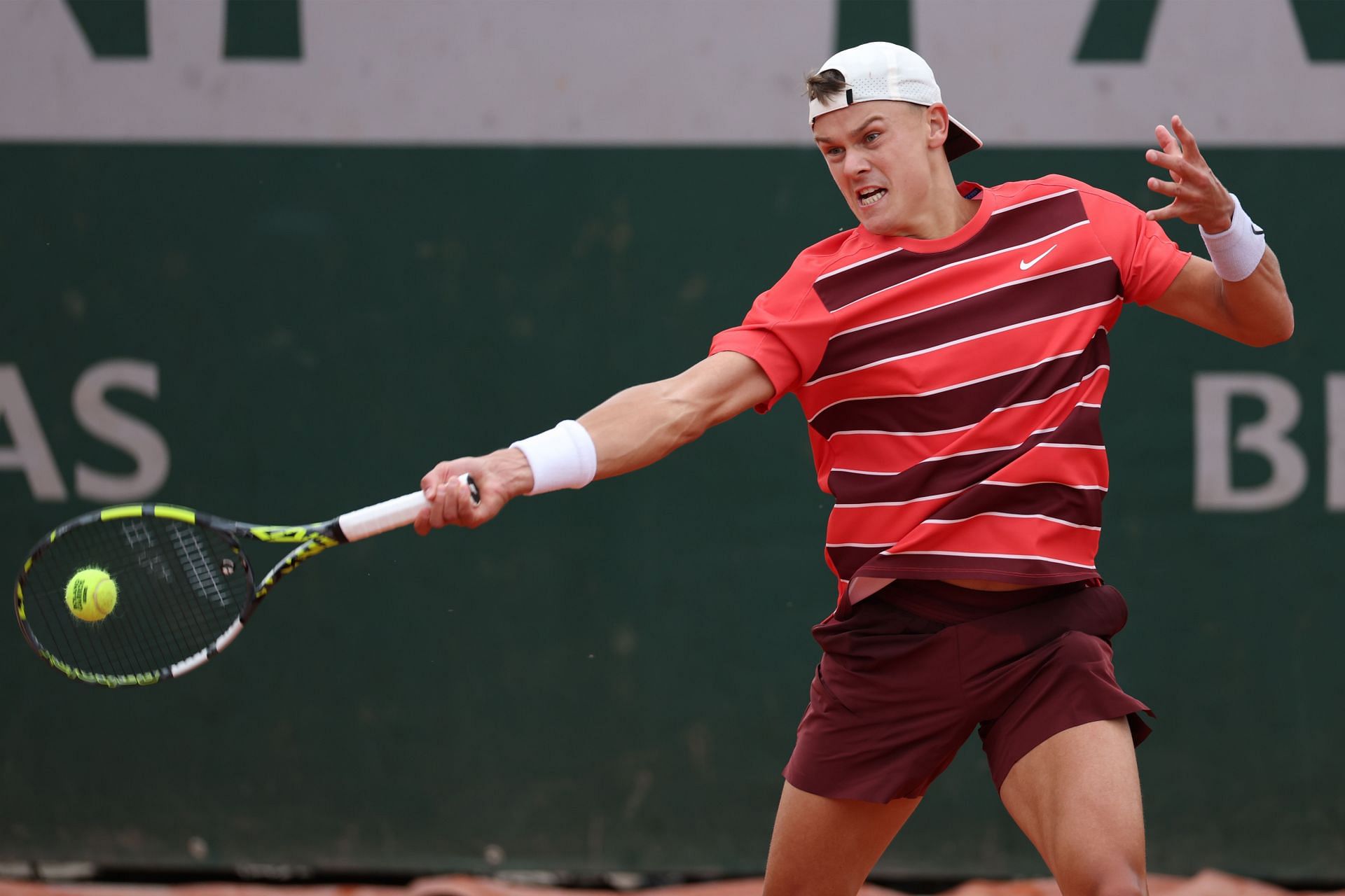 Holger Rune hits a forehand during his French Open 1R win | Image Source: Getty